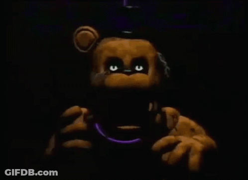 Teddy Bear With Glowing Eyes Holding Purple Necklace GIF