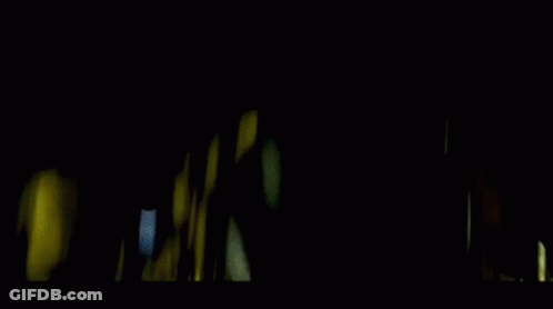 Teddy Bear With Glowing Eyes In Dark Room GIF