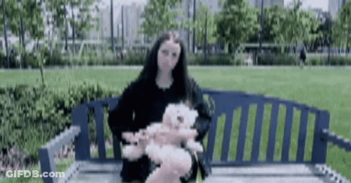 Teddy Bear With Pink And Blue Buttons On Eyes GIF
