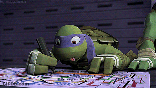 Teenage Mutant Ninja Turtle Lying On Table Writing GIF