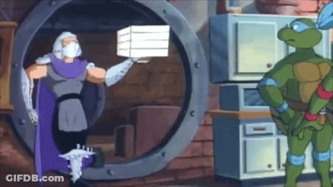 Teenage Mutant Ninja Turtle Standing Next To Pizza Box GIF