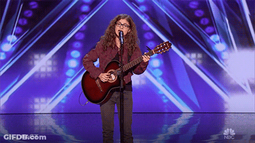 Teenager Playing Guitar On Stage GIF