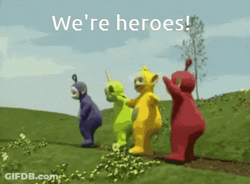 Teletubbies Standing In Grassy Field Saying We're Heroes GIF