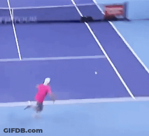 Tennis Player Hitting Ball On Purple Court With Tour On Net GIF