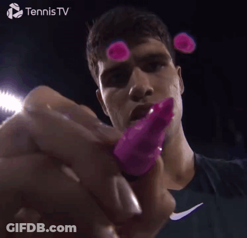 Tennis Player Holding Pink Object GIF