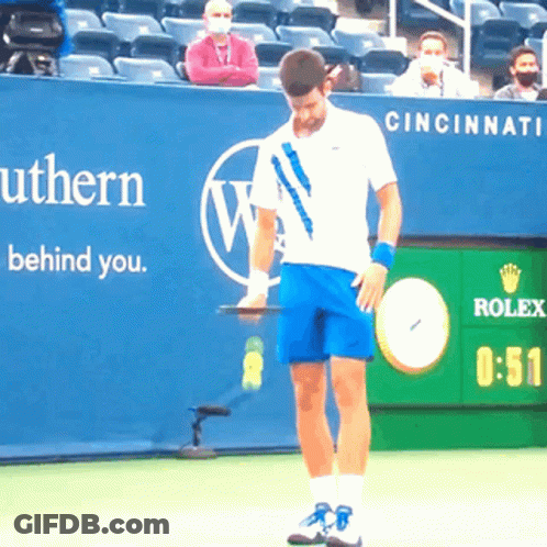 Tennis Player Holding Racquet In Front Of Rolex Sign GIF