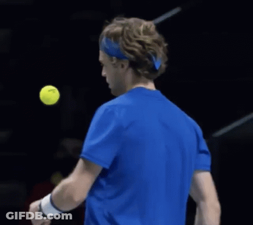 Tennis Player In Blue Shirt Hitting Ball GIF
