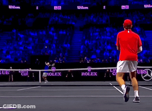 Tennis Player In Red Shirt Running On Court GIF