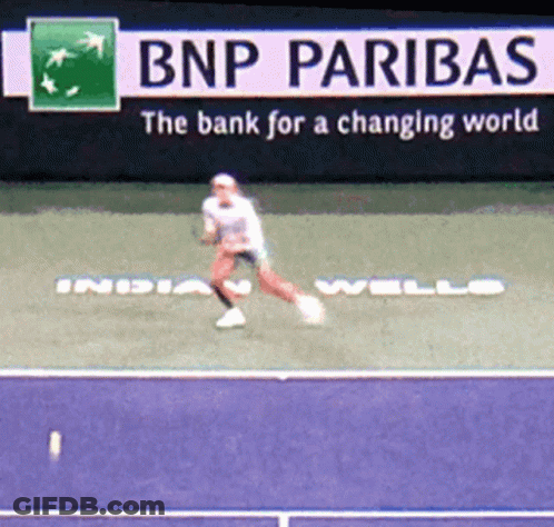 Tennis Player Jumping Near Paribas Sign GIF