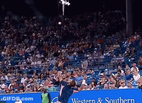 Tennis Player Jumping With Western & Southern Advertisement GIF