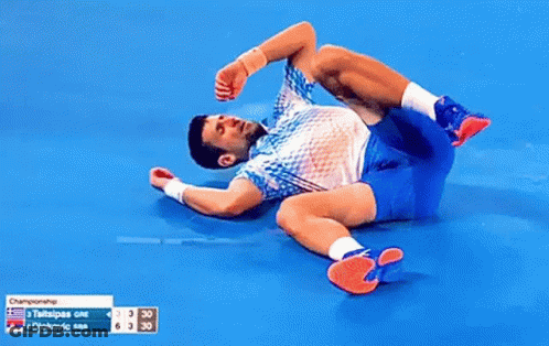 Tennis Player Lying On Ground Legs Crossed GIF