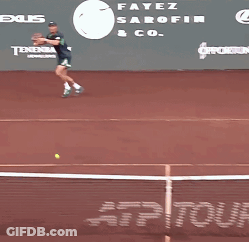 Tennis Player Running On Court In Front Of Tennis Channel Banner GIF