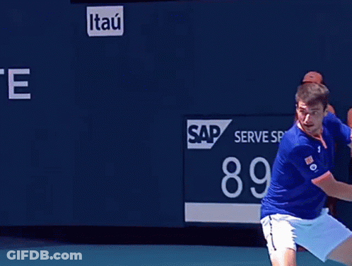 Tennis Player Swinging Racket At Ball With Scoreboard 89 MP GIF