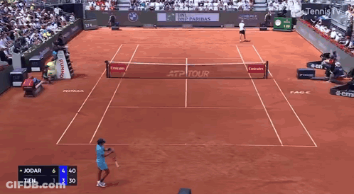 Tennis Player Swinging Racket In Front Of EA7 Sign GIF