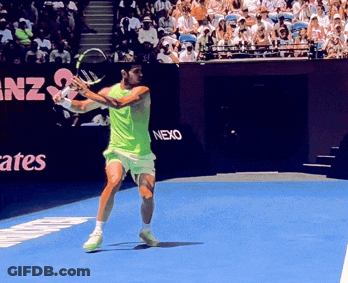 Tennis Player Swinging Racket In Front Of Nexo Sign GIF