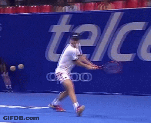 Tennis Player Swinging Racket In Front Of Telcel Sign GIF