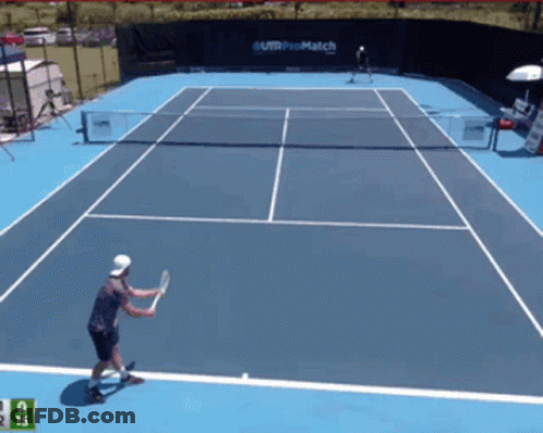 Tennis Player Swinging Racket In Front Of Telcel Sign GIF