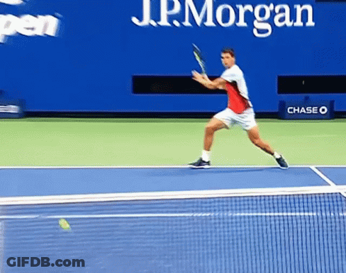 Tennis Player Swinging Racket On Chase Court GIF
