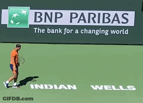 Tennis Player Walking Past BNP Pariba Sign GIF