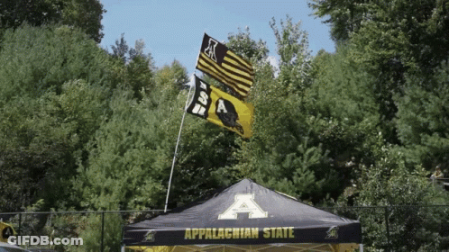 Tent Saying Appalachian State In Front Of Trees GIF
