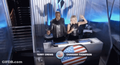 Terry Crews And Carissa Thompson Behind Table GIF