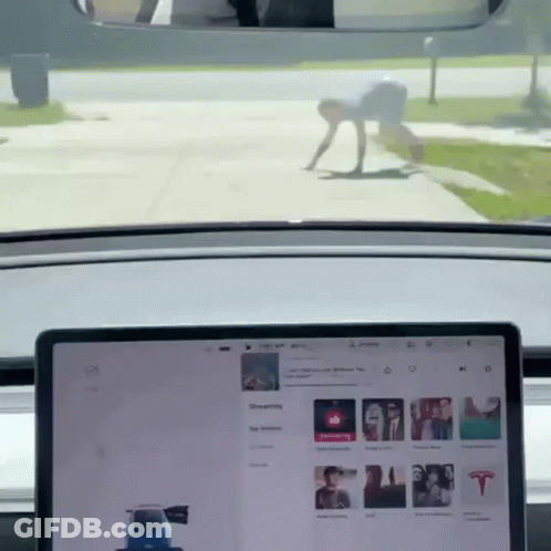Tesla Model 3 Driving Down Road GIF