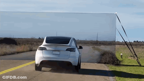 Tesla Model 3 Driving Down Road GIF