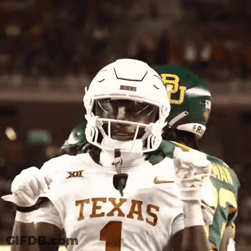 Texas Football Player In White Helmet And Gloves GIF