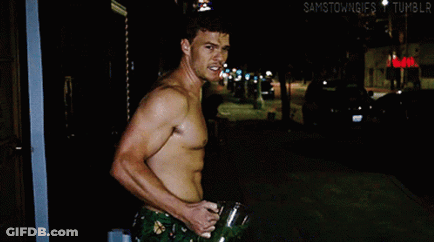 Thad Castle Alan Ritchson Holding Briefcase GIF