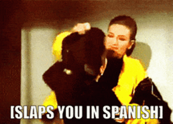 Thalia In Yellow Suit Slaps You In Spanish GIF