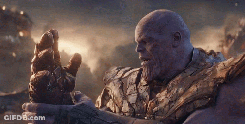 Thanos From Avengers Endgame Holds His Infinity Gauntlet In His Hand GIF