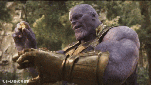 Thanos From Avengers Infinity War Is Holding A Piece Of Gold In His Hands GIF