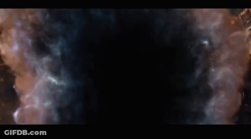Thanos From Avengers Infinity War Is Looking At The Camera With A Beard And A Gold Vest . GIF