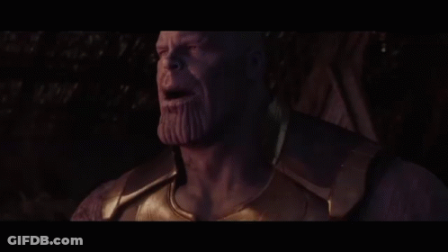 Thanos From Avengers Infinity War Is Smoking A Cigarette In A Dark Room . GIF