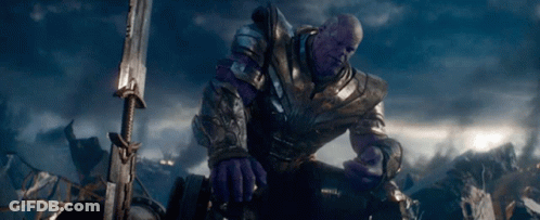 Thanos Is Kneeling Down With A Sword In Front Of Him GIF