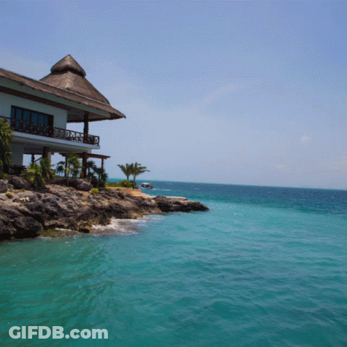 Thatched Roof House On Cliff GIF