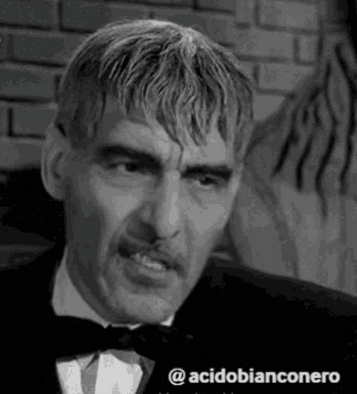 The Addams Family Lurch Smirking GIF