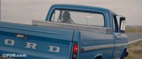 The Back Of A Blue Ford Truck Is Shown GIF