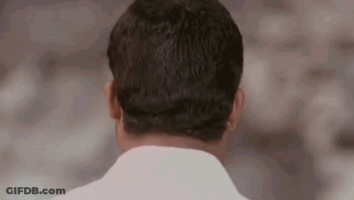 The Back Of A Man 'S Head Is Shown In This Close Up . GIF