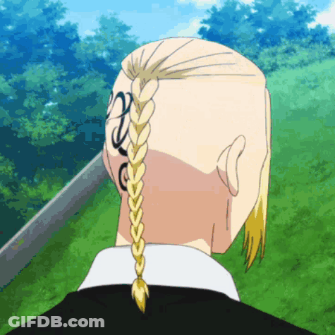 The Back Of A Man 'S Head With A Braid And A Tattoo On His Back . GIF