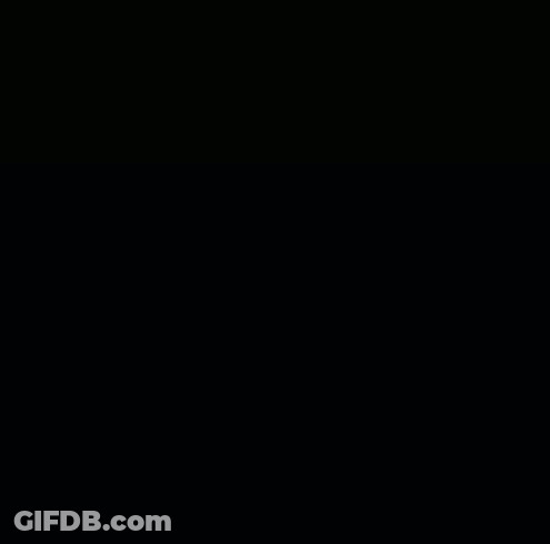 The Back Of A Man Wearing A Feathered Headdress GIF