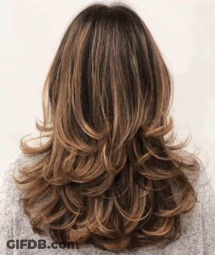 The Back Of A Woman 'S Hair With A Gray Sweater On GIF
