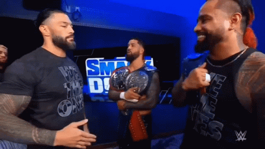 The Bloodline Roman Reigns Hugging Members GIF