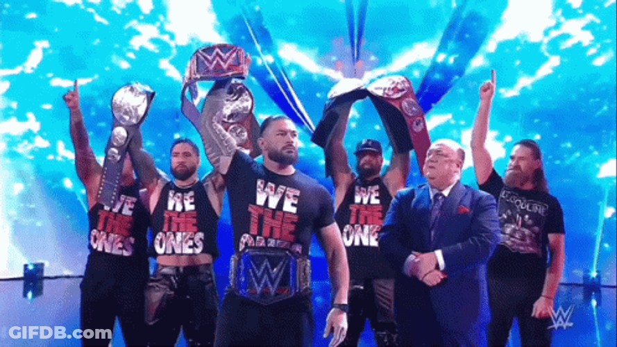 The Bloodline Showing Off Roman Reigns Belts GIF