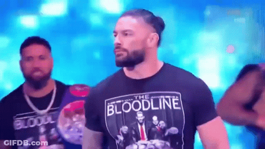 The Bloodline WWE Members Carrying Belts GIF