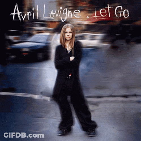 The Cover Of Avril Lavigne 'S Let Go Album Features A Woman Standing On A Street GIF