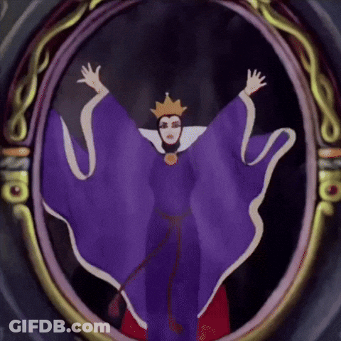 The Evil Queen From Snow White And The Seven Dwarfs Is Shown In A Mirror GIF