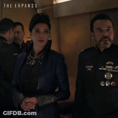 The Expanse Poster Woman And Man Standing Together GIF