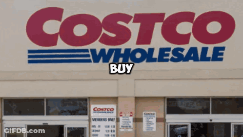 The Front Of A Costco Wholesale Store With A Sign That Says Buy GIF