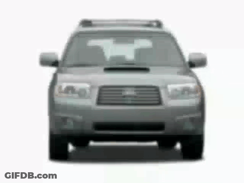 The Front Of A Subaru Forester Is Shown In A Black And White Photo . GIF